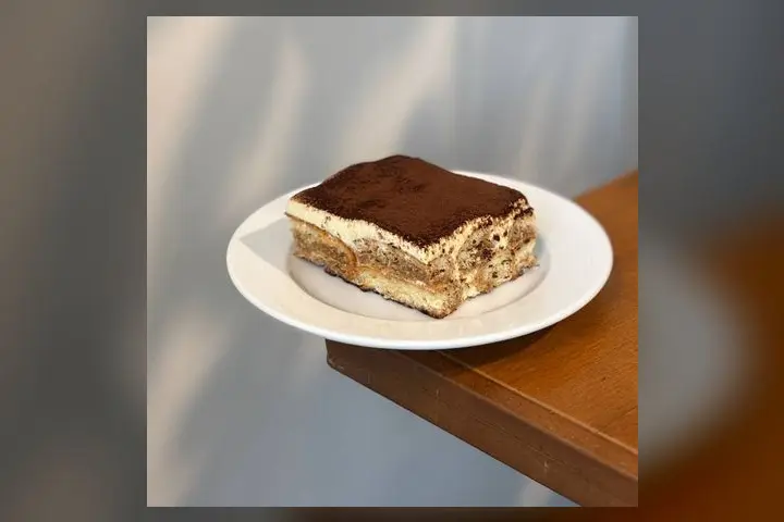 A slice of house-made tiramisu on a plate