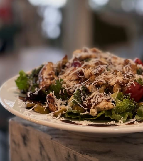 Fresh salad with grilled chicken, broccoli and parmesan